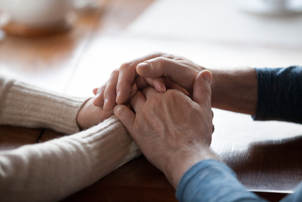 person holding helping hand