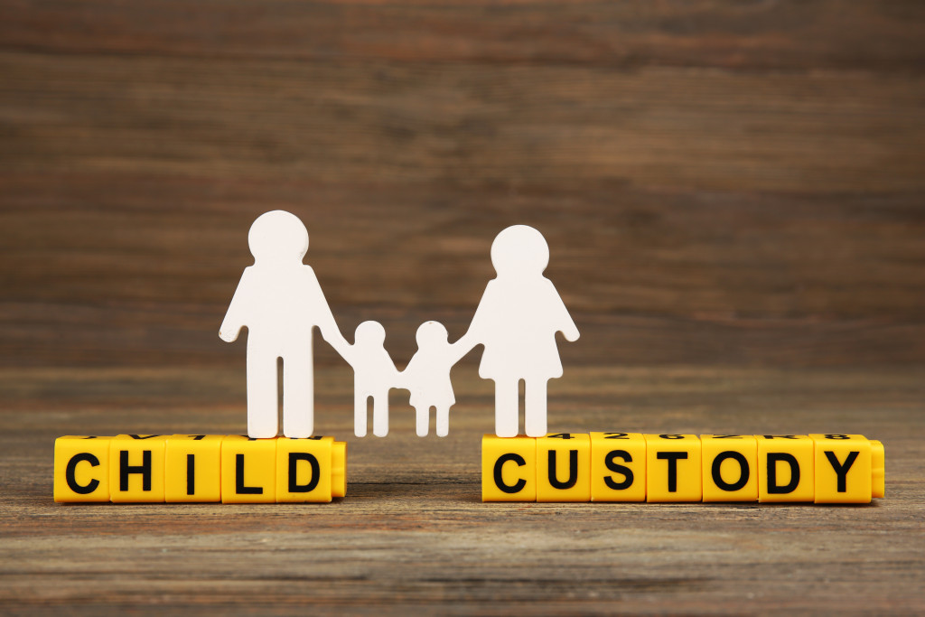 The words CHILD CUSTODY spelled with letter blocks with a family cutout above it